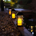 Waterproof outdoor solar lamp with candle flame effect, energy saving, warm white LED for patio, garden, lawn, terrace, tent, tree and garden - 2-pack
